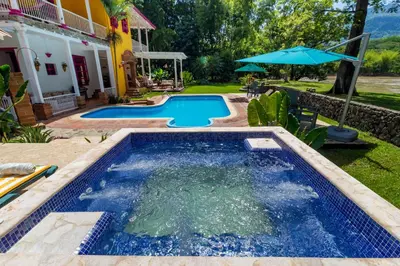 a swimming pool in the backyard of a house at Casa Etnika in Jericó