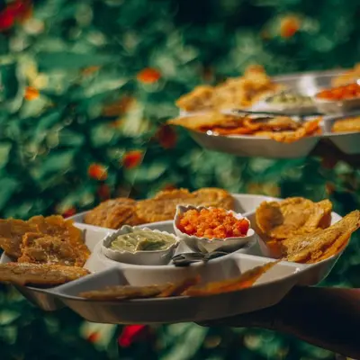a plate of food with appetizers and dips at EcoHotel Casa Maria Parda in Cocorná