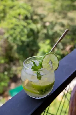 a drink with a spoon in a glass on a table at EcoHotel Casa Maria Parda in Cocorná