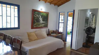 a bedroom with a bed and a table in a room at Casa Horizontes in San Carlos