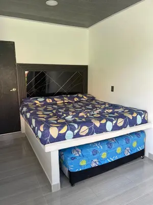 a bedroom with a bed in a room with at Apartamento vacacional Galeon Doradal in Doradal