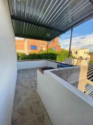 a patio with awning on a building at Apartamento vacacional Galeon Doradal in Doradal