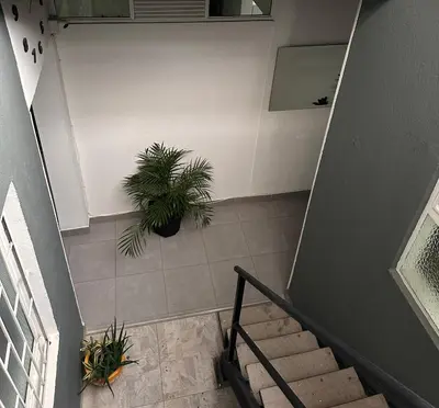 an overhead view of a staircase with a potted plant at Aparta estudio amoblado 4 Medellín, San Joaquín in Medellín