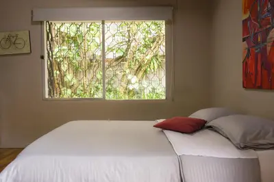 a bed in a room with a window at Alojamiento que permite mascota en Medellín A103 By Roots Rentals in Medellín