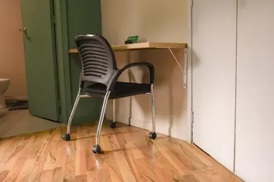 a black chair sitting in front of a desk at Alojamiento que permite mascota en Medellín A103 By Roots Rentals in Medellín