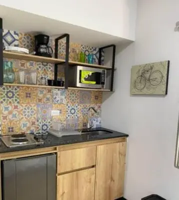 a kitchen with a sink and a counter top at Alojamiento que permite mascota en Medellín A103 By Roots Rentals in Medellín
