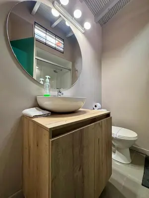 a bathroom with a sink and a mirror at Alojamiento que permite mascota en Medellín A103 By Roots Rentals in Medellín