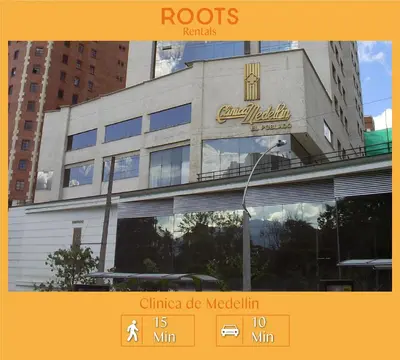 a building with a sign on the side of it at Cómodo aparta suite en zona Poblado Medellín M101 By Roots Rentals in Medellín