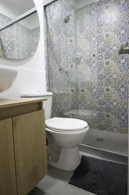 a bathroom with a toilet and a shower at Económica Suite en sector Manila el Poblado M102 By Roots Rentals in Medellín
