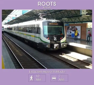 a train on the tracks at a train station at Económica Suite en sector Manila el Poblado M102 By Roots Rentals in Medellín