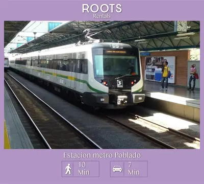a train on the tracks at a train station at Hospedaje cerca a Provenza en el Poblado - M301 By Roots Rentals in Medellín
