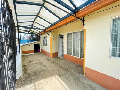 an empty hallway of a building with a glass ceiling at Casa Los Patios in Jericó