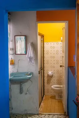 a bathroom with a sink and a toilet at Casa Los Patios in Jericó