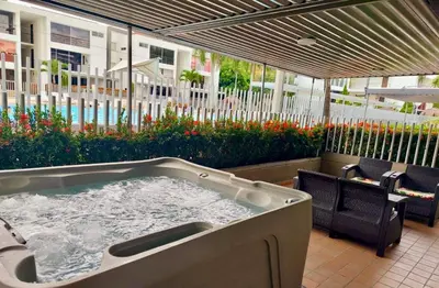 a jacuzzi tub sitting on a patio at Apartasol Ciudadela Santa Fé in Santa Fe de Antioquia