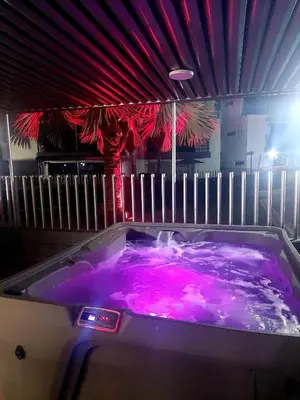 a jacuzzi tub with purple lights in a room at Apartasol Ciudadela Santa Fé in Santa Fe de Antioquia