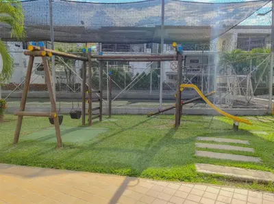 a park with a playground with a slide at Apartasol Ciudadela Santa Fé in Santa Fe de Antioquia