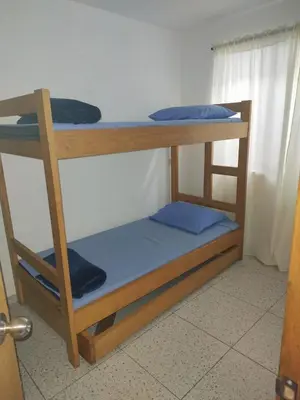 a bunk bed in a room with two bunk beds at Apartamento acogedor para vacacionar o de trabajo in Rionegro