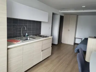 a kitchen with a sink and a counter top at Casa Azul - Apartamentos Amoblados - in Manizales