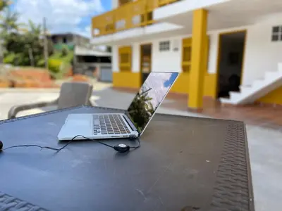 a laptop computer sitting on top of a table at Palmar de Jericó Suites in Jericó