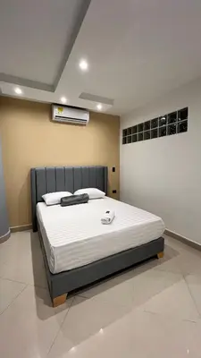 a bedroom with a bed in a room at Hotel Gran Conquistador 33 in Medellín