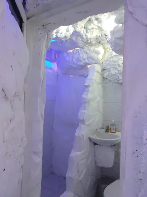 a white bathroom with a toilet and a sink at Glamping Spa & Coffee Tour in Medellín