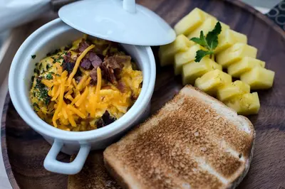 a plate of food with a bowl of soup and toast at AKOA GLAMPING Eco-Luxury Hotel in Guarne