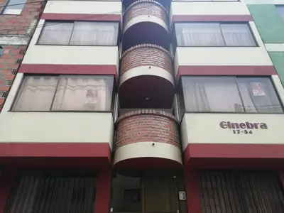 an apartment building with a fire stack at Habitaciones en Edificio Ginebra Manizales in La Linda