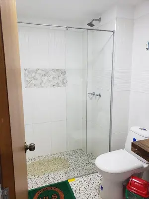 a bathroom with a shower and a toilet at HOTEL LA SELVA JARDIN in Jardin