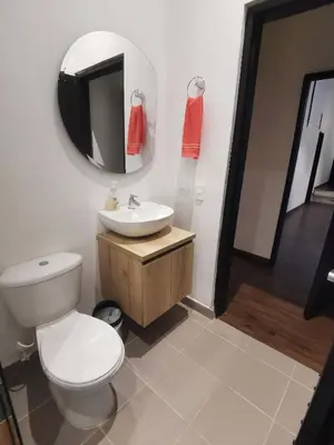 a bathroom with a toilet and a sink and a mirror at Studio in Poblado near Envigado FRN103 By Roots Rentals in Medellín