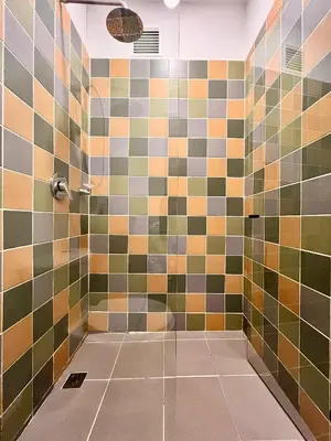 a bathroom with a shower with colorful tiles at Loft equipado en Poblado cerca de Envigado FRN107 By Roots Rentals in Medellín