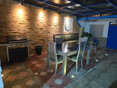 a kitchen with a table and chairs and a stove at Casa Hotel Victoria Real in Mariquita