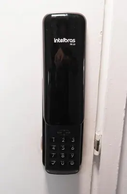 a black cell phone is sitting on a wall at Casa La Palma Habitación Cielo in Medellín
