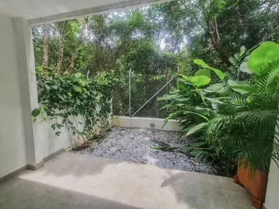 a garden with a fence and some plants at Hotel Monte Bello in Doradal