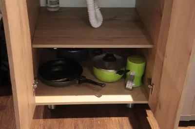 a cabinet filled with pots and pans at Apartamento en el Poblado, permite mascota FRN102 By Roots Rentals in Medellín
