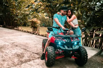 a man and woman riding on a four wheeler at Chamí Glamping in Manizales