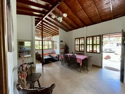 a dining room with a table and chairs at finca Encanto in Guarne
