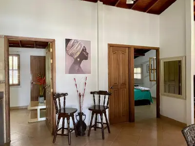 a living room with two chairs and a table at finca Encanto in Guarne