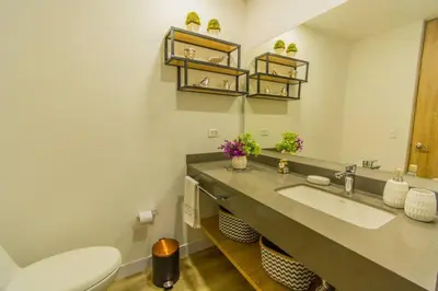a bathroom with a sink and a toilet at Luxury Suite in El Poblado Co-Work, Gym, Fast WiFi in Medellín