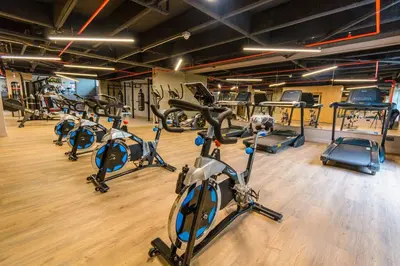 a gym with a bunch of cardio bikes and exercise bikes at Luxury Suite in El Poblado Co-Work, Gym, Fast WiFi in Medellín