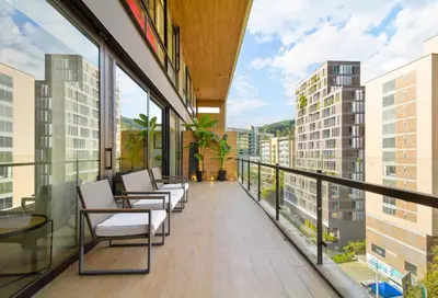 a balcony with chairs and tables on a building at Energy 801 in Medellín