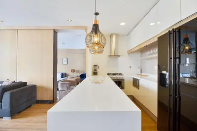 a kitchen and living room with a white counter top at Energy 801 in Medellín