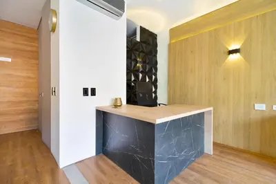 a bar in a room with a wall of wine bottles at Energy 801 in Medellín