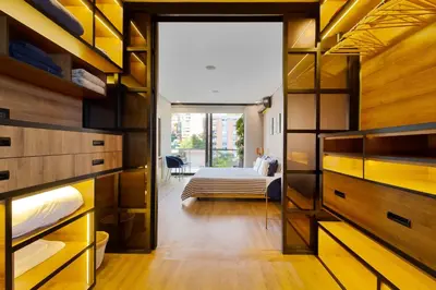 a room with a bedroom with a bed and a window at Energy 801 in Medellín