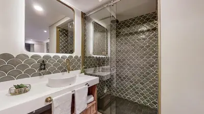 a bathroom with a sink and a mirror at Origen Hotel Boutique in Medellín