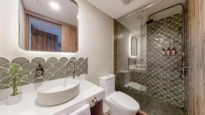 a bathroom with a sink and a toilet and a shower at Origen Hotel Boutique in Medellín