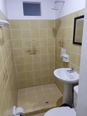 a bathroom with a sink and a toilet at Cabaña 52 en la Aldea Doradal Santorini Colombiano in Doradal