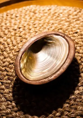 a wooden bowl sitting on top of a table at Topá House in Medellín
