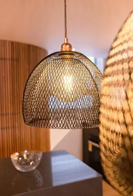 a lamp on top of a table in a room at Topá House in Medellín