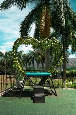a bench with a heart made out of vines at Hotel Villa Alicia in San Jerónimo