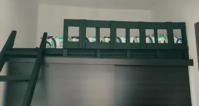 a green shelf with surfboards on top of it at Apartamento vacacional en Medellín central privado y tranquilo in Medellín